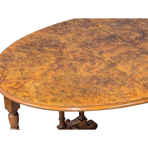 1041 - A large Victorian Burr Walnut Sutherland table. Circa 1870. 118x56x74cm(6)