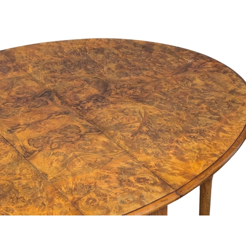 1041 - A large Victorian Burr Walnut Sutherland table. Circa 1870. 118x56x74cm(6)