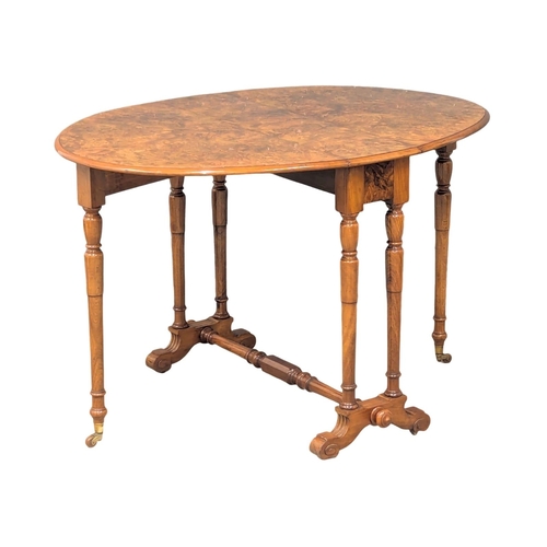 1041 - A large Victorian Burr Walnut Sutherland table. Circa 1870. 118x56x74cm(6)