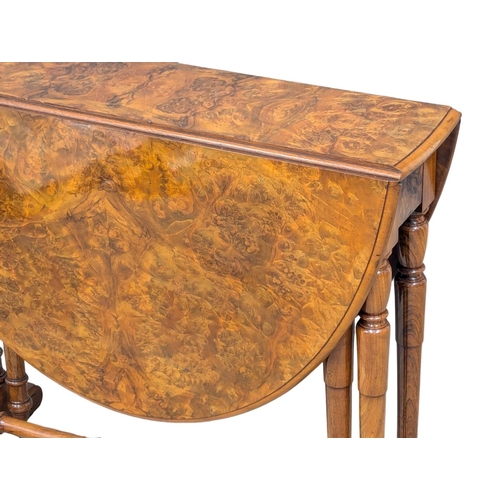 1041 - A large Victorian Burr Walnut Sutherland table. Circa 1870. 118x56x74cm(6)