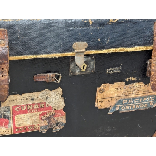 253 - A Late 19th Century dome topped trunk with original shipping labels and interior. Cunard Line, Railw... 