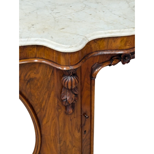 808 - A Victorian walnut Serpentine front marble top credenza with mirrored panelled doors. 149x46x90cm(1)