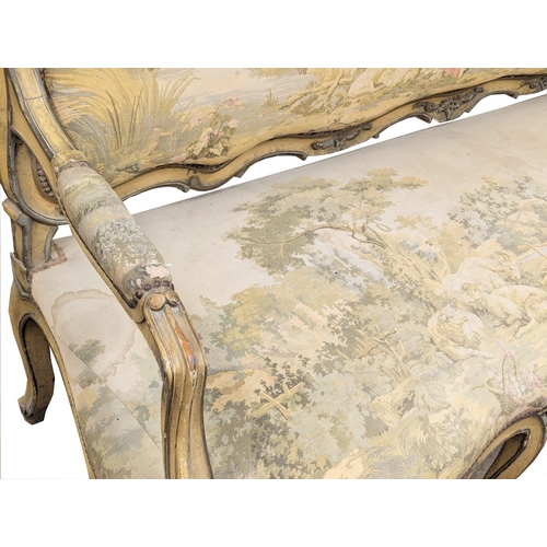 833 - A large 19th Century Louis XV style sofa with needlepoint work and original French cream painted fin... 