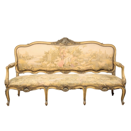 833 - A large 19th Century Louis XV style sofa with needlepoint work and original French cream painted fin... 