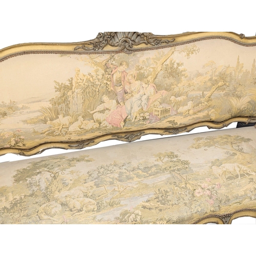 833 - A large 19th Century Louis XV style sofa with needlepoint work and original French cream painted fin... 