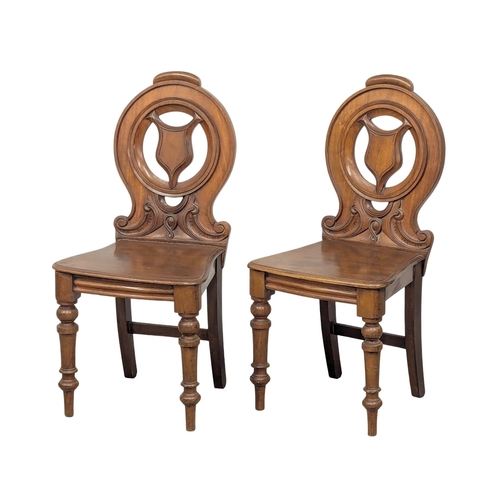 839 - A pair of Victorian mahogany hall chairs on turned legs. Circa 1870s (2)