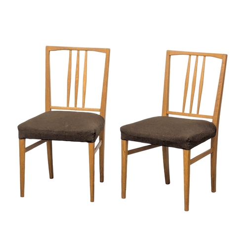 847 - A set of 8 Mid Century ash dining chairs by Gordon Russell. (3)