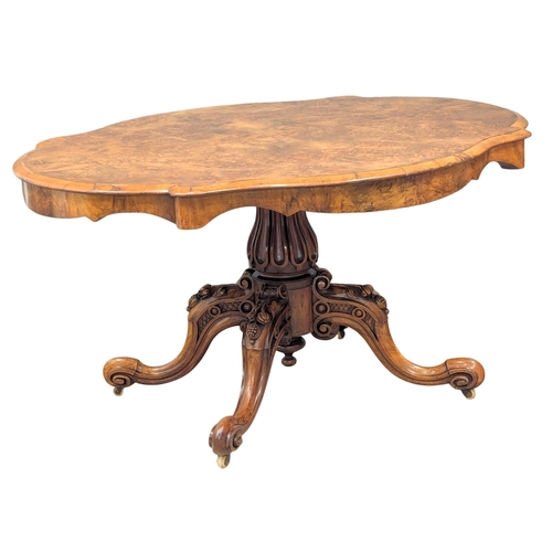 850 - A Victorian Burr Elm tilt top pedestal breakfast table / dining table on Cabriole legs. Circa 1860-1... 