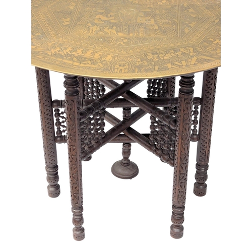 855 - A large Late 19th Century / Early 20th Century Egyptian Revival engraved brass top folding table. 72... 