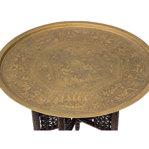 855 - A large Late 19th Century / Early 20th Century Egyptian Revival engraved brass top folding table. 72... 