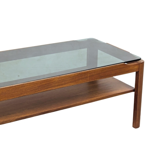 858 - A Mid Century teak coffee table with smoked glass top by Myer. 88x44x35cm(10)