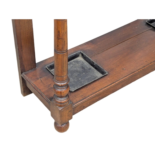 867 - A Late Victorian walnut hall stand. Circa 1890s. 97.5x29x211cm(11)