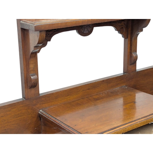 867 - A Late Victorian walnut hall stand. Circa 1890s. 97.5x29x211cm(11)