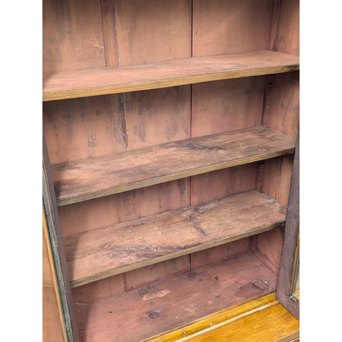 868 - A Victorian walnut bookcase. 88x38x200cm(1)