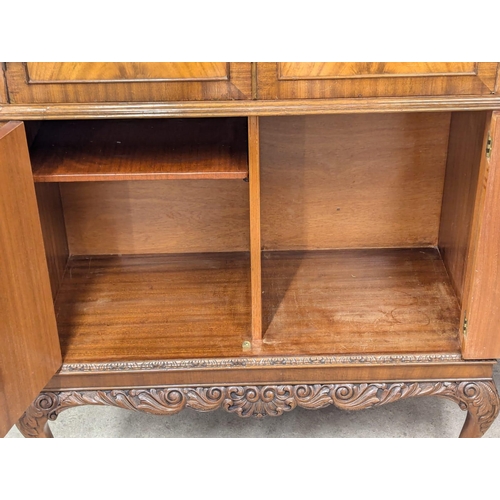 874 - A vintage Georgian style mahogany cocktail cabinet with maple interior. 94x45x162.5cm(10)