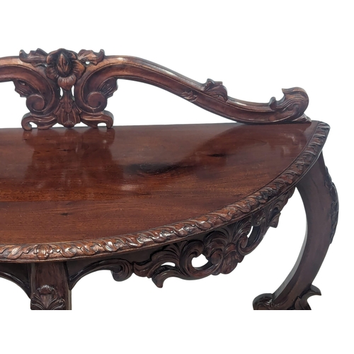 888 - An ornate mahogany hall table on Cabriole legs. 93x38x91cm(1)