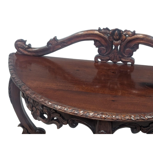 888 - An ornate mahogany hall table on Cabriole legs. 93x38x91cm(1)