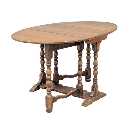 893 - A 17th Century style oak gateleg table. 150x93x76cm extended.(10)