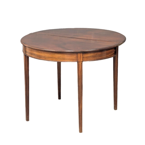 894 - A George III mahogany demi-lune tea table. 93x46x74cm (5)