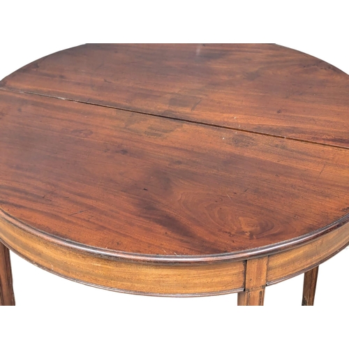 894 - A George III mahogany demi-lune tea table. 93x46x74cm (5)