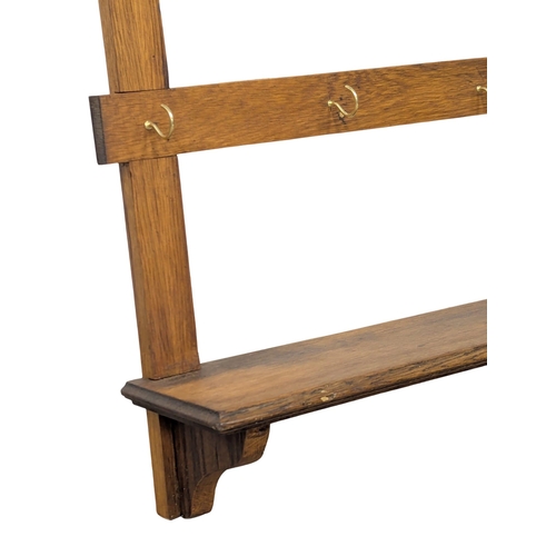 906 - A large Late 19th Century oak wall hanging hat and coat rack. 99x15.5x92cm (9)