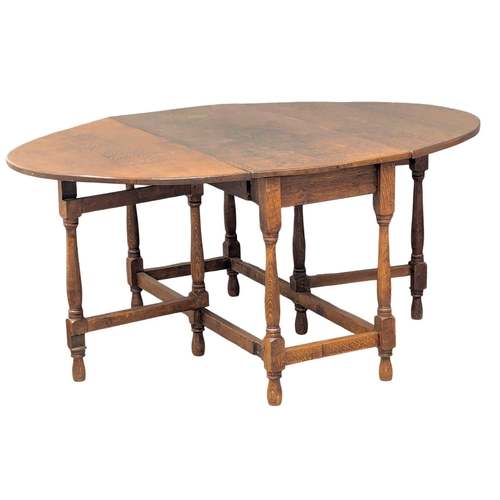 909 - A late 19th century  Georgian style oak  dropleaf table. Circa 1800. 162x123x73cm extended(1)