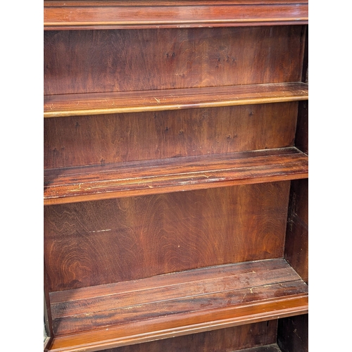 911 - A 1930s mahogany sectional bookcase with lead glass doors by Minty. 89x29x150cm(1)