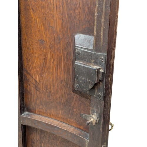 912 - A Late 18th Century George III oak wall hanging corner cupboard with fitted shelves. 65x46x107cm(7)