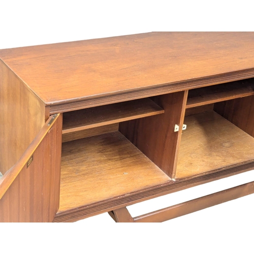 918 - A Mid Century teak sideboard by Beautility. 214x44x76.5cm (2)