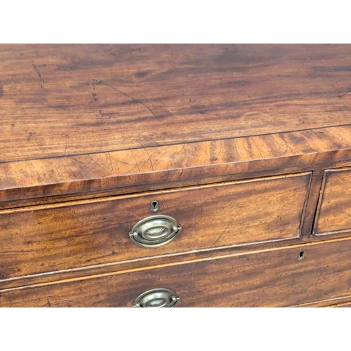 953 - A Late George III inlaid mahogany chest of drawers on sprayed bracket feet. Circa 1800-1810. 107x50x... 