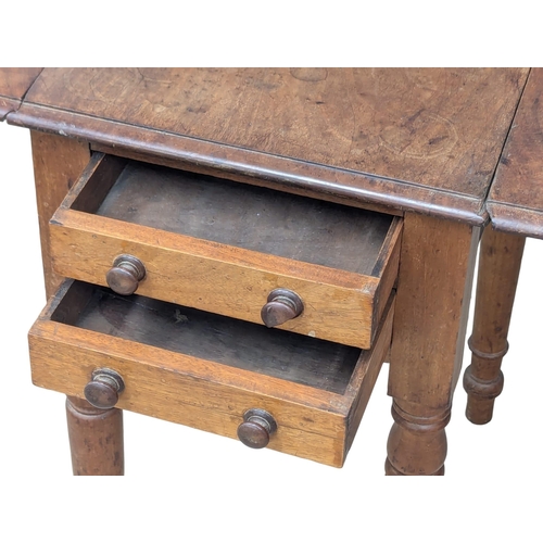 956 - A small Victorian mahogany Pembroke table with two drawers and two dummy drawers. 72x49x66cm(1)