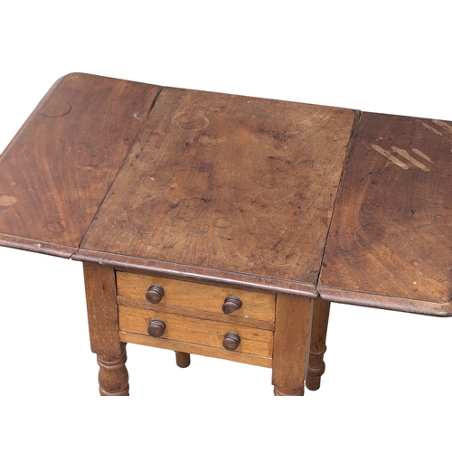 956 - A small Victorian mahogany Pembroke table with two drawers and two dummy drawers. 72x49x66cm(1)