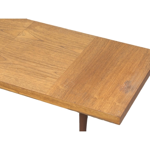 972 - A Mid Century teak coffee table. 117x46x35cm(1)