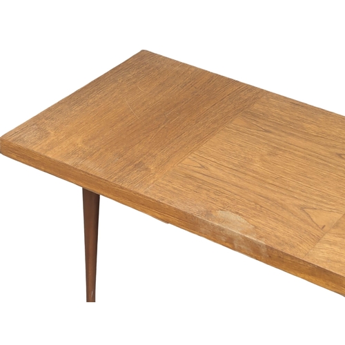 972 - A Mid Century teak coffee table. 117x46x35cm(1)