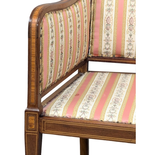 977 - An Early 20th Century Sheraton Revival inlaid mahogany armchair. Circa 1900-1910. 54x102cm
(8)