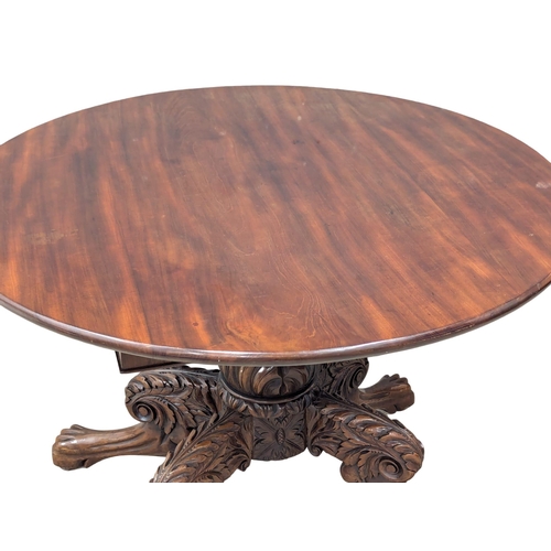 983 - A William IV mahogany breakfast table on lion paw feet. Circa 1830s. 99x71cm (2)