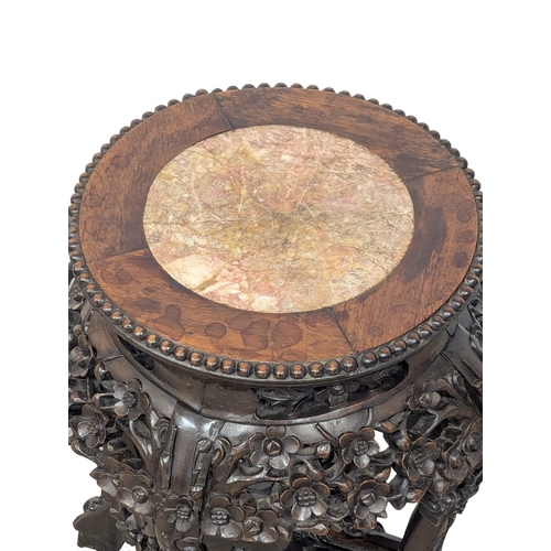 990 - A Late 19th Century Burmese carved rosewood marble top plant stand. 34x46cm(3)