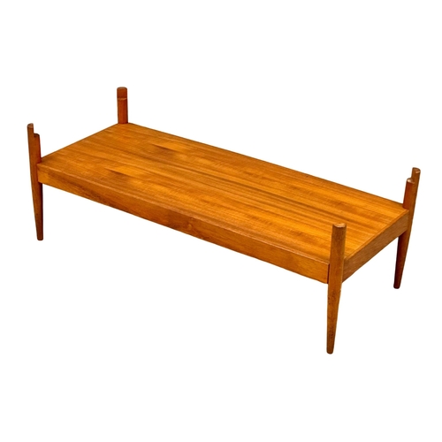 807 - A Mid Century teak turnover coffee table bench. With black vinyl top. Pleasing Furniture by PYE-Fran... 