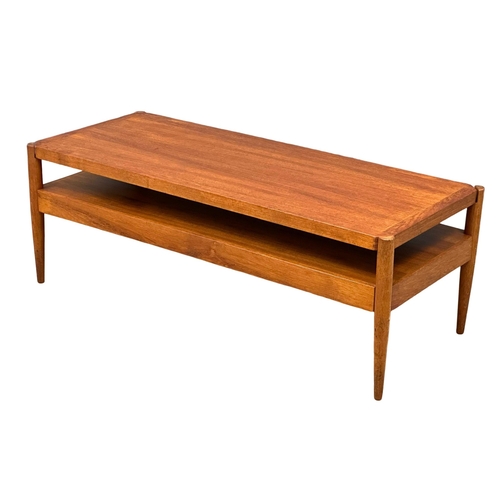 807 - A Mid Century teak turnover coffee table bench. With black vinyl top. Pleasing Furniture by PYE-Fran... 