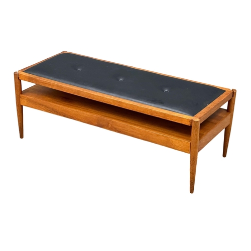 807 - A Mid Century teak turnover coffee table bench. With black vinyl top. Pleasing Furniture by PYE-Fran... 