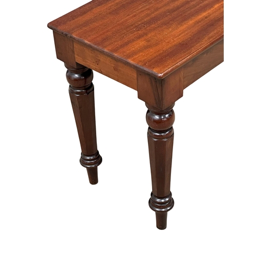 811 - A long Mid Victorian mahogany bench/stool. Circa 1860-1870. 111x30x43cm (8)