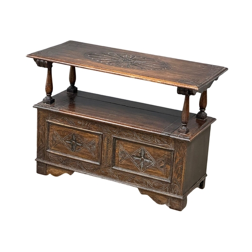 856 - A Victorian oak turnover monks bench. Combination side table, with lift up storage. 19th Century. Ci... 