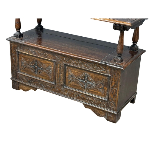 856 - A Victorian oak turnover monks bench. Combination side table, with lift up storage. 19th Century. Ci... 