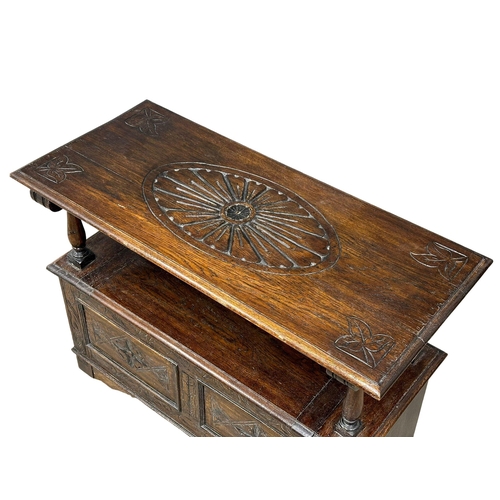 856 - A Victorian oak turnover monks bench. Combination side table, with lift up storage. 19th Century. Ci... 