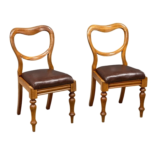 901 - A pair of Victorian balloon back chairs, with leather seats and turned legs. 19th Century. Circa 187... 