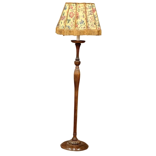 903 - A good quality 1930’s oak standard lamp with reeded column and original shade. 178cm(10)