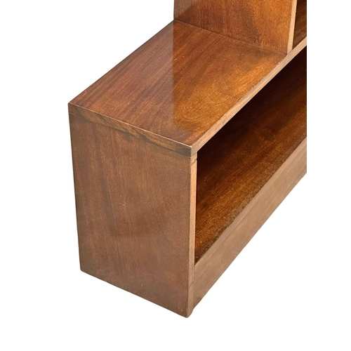 926 - A Mid 20th Century mahogany stepping open bookcase. 106.5x25.5x91.5cm.(10)