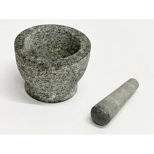 750 - A granite mortar & pestle. 14.5x10.5cm.