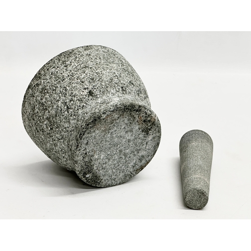 750 - A granite mortar & pestle. 14.5x10.5cm.