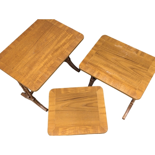 1028 - A nest of tables by Nathan Furniture.(9)